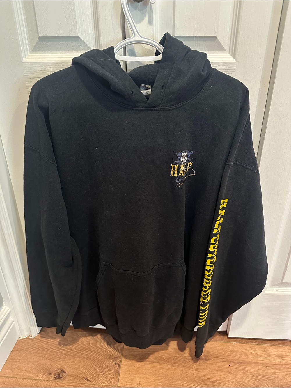 Black Hooded Pullover Sweatshirt with Yellow Accent